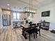 Dining room with stylish light fixture, modern table set, and an adjacent kitchen at 251 Summers Dr, Summerville, SC 29485