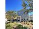 Charming two-story home with welcoming front porch and landscaped garden beds at 251 Summers Dr, Summerville, SC 29485