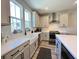 Modern kitchen with white cabinets, quartz countertops, and stainless steel appliances at 251 Summers Dr, Summerville, SC 29485