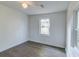 This bedroom features great natural lighting, with luxury vinyl plank flooring and neutral walls at 2604 Ferrara Dr, North Charleston, SC 29405