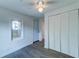 This bedroom has ample closet space, luxury vinyl plank flooring, and neutral walls at 2604 Ferrara Dr, North Charleston, SC 29405