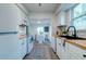 Efficient kitchen with modern appliances, light cabinetry, and an adjacent dining area at 2604 Ferrara Dr, North Charleston, SC 29405