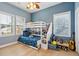 Cozy bedroom with a bunk bed, natural light, and playful decor with hardwood flooring at 307 Shoals Dr, Mount Pleasant, SC 29464