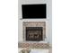Living room fireplace with brick surround and white mantel, creating a cozy focal point at 307 Shoals Dr, Mount Pleasant, SC 29464