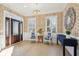Foyer with hardwood floors, decorative wallpaper, a chandelier and a front door at 307 Shoals Dr, Mount Pleasant, SC 29464