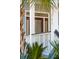 Close up of a charming front entrance with sidelights, transom window and railing at 307 Shoals Dr, Mount Pleasant, SC 29464