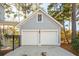 Detached two-car garage with painted siding and concrete driveway at 307 Shoals Dr, Mount Pleasant, SC 29464