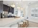 Kitchen island with bar stool seating, pendant lights, stainless steel appliances, and white countertops at 307 Shoals Dr, Mount Pleasant, SC 29464