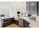 Modern kitchen with white countertop island, stainless steel appliances, hardwood floors, and open layout at 307 Shoals Dr, Mount Pleasant, SC 29464