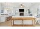 Inviting living room featuring shiplap walls, fireplace, and open access to the kitchen at 307 Shoals Dr, Mount Pleasant, SC 29464