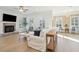 Spacious living room with a fireplace, hardwood floors, and plenty of natural light at 307 Shoals Dr, Mount Pleasant, SC 29464