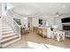 Open-concept living room featuring a fireplace, hardwood floors, and abundant natural light at 307 Shoals Dr, Mount Pleasant, SC 29464