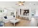 Open-concept living area featuring hardwood floors and modern decor, seamlessly flowing into the kitchen at 307 Shoals Dr, Mount Pleasant, SC 29464