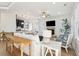 Bright living room with a fireplace, hardwood floors, shiplap, and ample seating at 307 Shoals Dr, Mount Pleasant, SC 29464