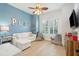 Charming playroom with a comfortable white couch, natural light and playful decor with hardwood flooring at 307 Shoals Dr, Mount Pleasant, SC 29464