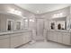 Large primary bathroom with a walk-in shower, white cabinets, and double sinks at 311 Weston Hall Dr, Summerville, SC 29483