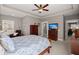 Bedroom with a ceiling fan includes a dresser with a TV and an entrance to a bathroom at 311 Weston Hall Dr, Summerville, SC 29483