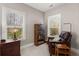 Bedroom featuring a leather chair, lamps, and a dresser near the window at 311 Weston Hall Dr, Summerville, SC 29483