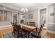 Elegant dining room featuring a large wooden table with seating for six and chandelier lighting at 311 Weston Hall Dr, Summerville, SC 29483