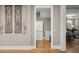 Hallway features beautiful wood floors, decorative wall hangings and an inviting doorway to the rest of the home at 311 Weston Hall Dr, Summerville, SC 29483