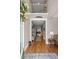 Elegant foyer with hardwood floors, high ceilings, and a view of the home's interior through an arched doorway at 311 Weston Hall Dr, Summerville, SC 29483