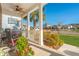 Inviting front porch with seating, a ceiling fan, and a view of the lush landscaping and neighborhood at 311 Weston Hall Dr, Summerville, SC 29483