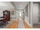 Long hallway featuring hardwood floors, neutral walls and framed decor, offering access to multiple rooms at 311 Weston Hall Dr, Summerville, SC 29483