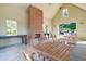 Inside a large covered area with tables and chairs is a brick fireplace for cozy gatherings at 311 Weston Hall Dr, Summerville, SC 29483