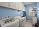Convenient laundry room with lots of cabinet storage, modern washer and dryer and laundry sink at 311 Weston Hall Dr, Summerville, SC 29483