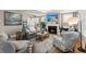 Spacious living room with a fireplace, TV, hardwood floors and a large window for natural light at 311 Weston Hall Dr, Summerville, SC 29483