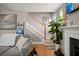 Cozy living room with a staircase, fireplace, and comfortable seating area at 311 Weston Hall Dr, Summerville, SC 29483