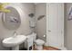 Stylish powder room with a modern vanity, round mirror, and elegant wall decor at 311 Weston Hall Dr, Summerville, SC 29483