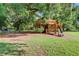 Playground with a custom wooden treehouse, swings, slide, and stairs for exclusive resident use at 311 Weston Hall Dr, Summerville, SC 29483