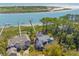 Overhead shot of beautiful homes near waterfront with private docks, framed by lush foliage at 3121 Marshgate Dr, Johns Island, SC 29455