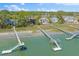 Stunning aerial shot of waterfront homes, featuring private docks and access to tranquil water at 3121 Marshgate Dr, Johns Island, SC 29455
