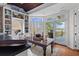 Bright dining area with scenic views, built-in shelves, and easy access to outdoor deck at 3121 Marshgate Dr, Johns Island, SC 29455