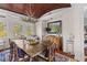 Bright dining room with a wooden table, soft chairs, and a stylish antler chandelier creating a cozy atmosphere at 3121 Marshgate Dr, Johns Island, SC 29455