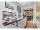 Welcoming hallway with skylights, featuring unique decor and a view into the elegant dining area at 3121 Marshgate Dr, Johns Island, SC 29455