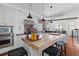 Modern kitchen with a large island, stainless steel appliances, and ample counter space at 3121 Marshgate Dr, Johns Island, SC 29455