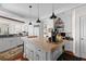 Bright and airy kitchen featuring an island, and white cabinetry at 3121 Marshgate Dr, Johns Island, SC 29455