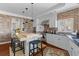 Modern kitchen with a large island, brick accents, and stainless steel appliances at 3121 Marshgate Dr, Johns Island, SC 29455