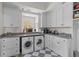 Well-organized laundry room featuring side-by-side washer and dryer, ample counter space, and plenty of cabinets at 3121 Marshgate Dr, Johns Island, SC 29455