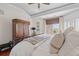 Comfortable main bedroom featuring a leather bed frame, coffered ceiling, and access to a private balcony at 3121 Marshgate Dr, Johns Island, SC 29455
