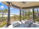 Relaxing covered porch with seating, offering picturesque water views and a refreshing outdoor space at 3121 Marshgate Dr, Johns Island, SC 29455