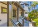 Inviting outdoor porch area with neutral trim accents, wood flooring and decorative railing at 3121 Marshgate Dr, Johns Island, SC 29455