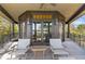 Charming covered porch featuring stylish chairs, creating a cozy outdoor retreat with water views at 3121 Marshgate Dr, Johns Island, SC 29455