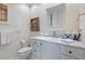 Elegant powder room features marble countertop and decorative patterned walls, plus a decorative towel and art at 3121 Marshgate Dr, Johns Island, SC 29455