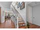 Elegant staircase leading to the upper level with stylish decorations and wood flooring at 3121 Marshgate Dr, Johns Island, SC 29455