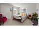 Bright bedroom with a metal bed frame, decorative chairs, and artwork at 315 Black Birch Dr, Summerville, SC 29486