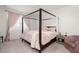 Bedroom featuring a four-poster bed, soft carpet, and a bright window at 315 Black Birch Dr, Summerville, SC 29486
